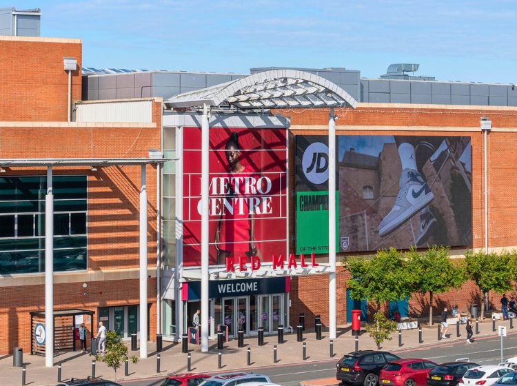 External image of Metrocentre showing a JD advert on screen. Outside Red Mall.