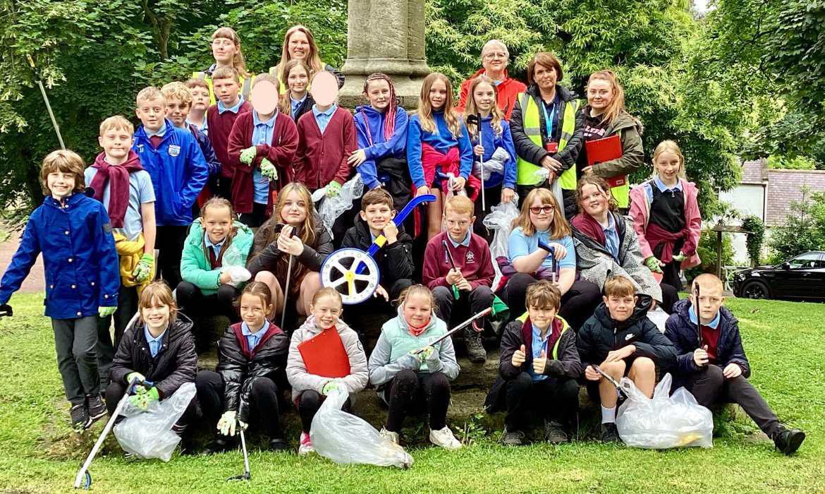 Ryton Junior School with Metrocentre volunteers after cleaning the litter from the area