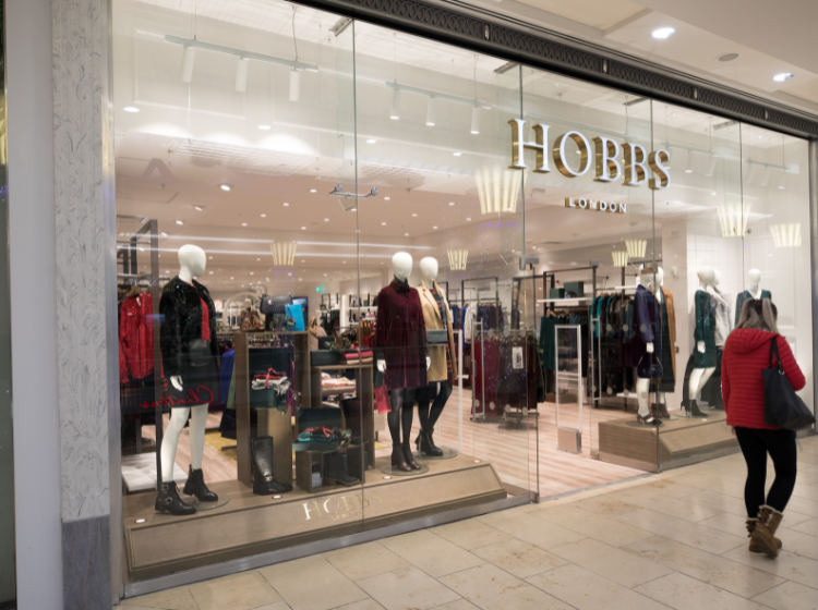 Image of Hobbs Entrance with a person walking by